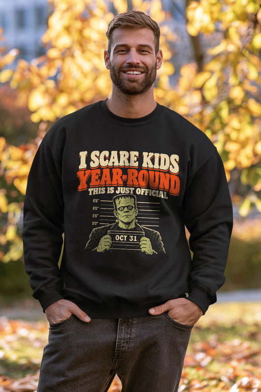 Lifestyle mockup of person wearing I Scare Kids Year Round Crewneck